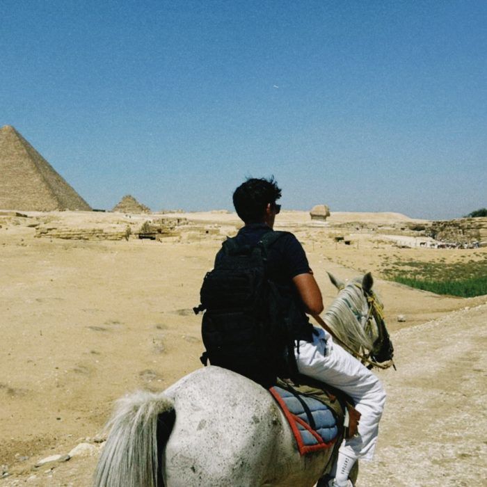 Muhammad Ali on horseback at the Giza pyramids